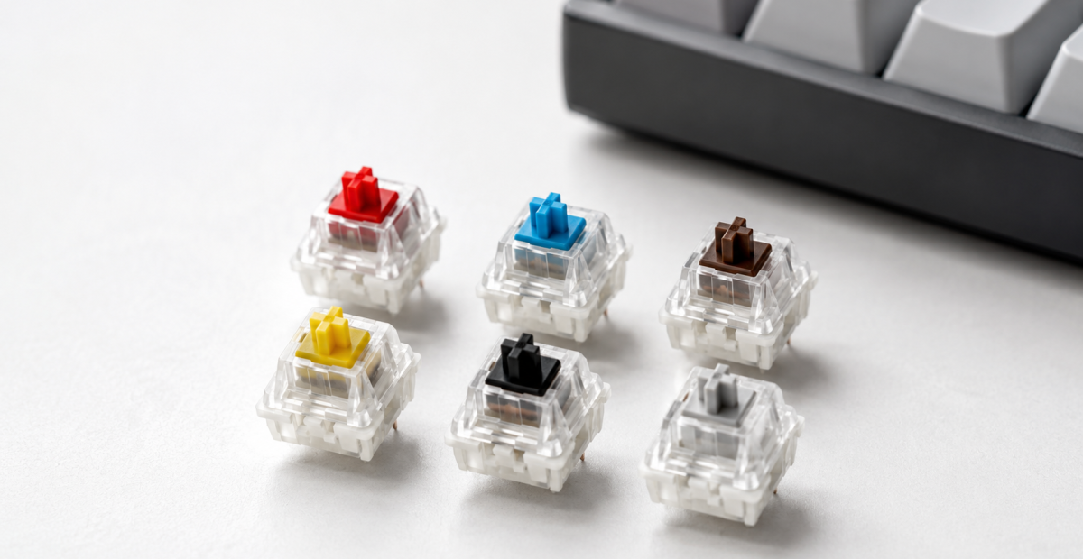 Switches de teclado mecânico em diferentes cores representando os principais tipos usados em teclados gamer.